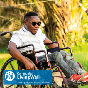 a young male wheelchair user wearing sunglasses visits his local park as part of his self-care