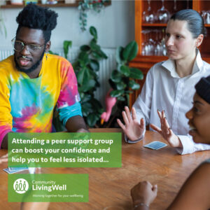 a group of people sitting around a talking talking during a peer support group