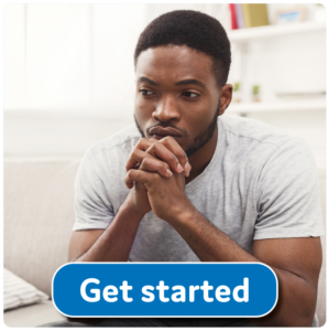 image shows a men resting his head on his clasped hands, he looks concerned or deep in thought. A button on the image reads get started and links to the community living well self-referral form